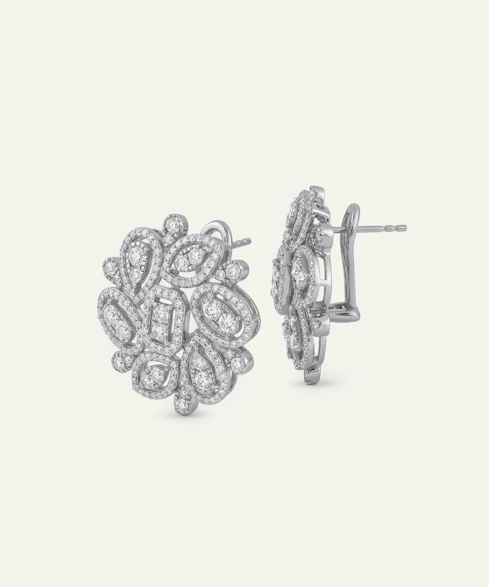 Pair of silver earrings on a light gray background