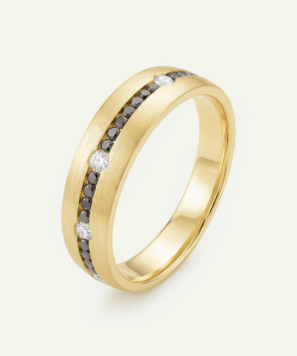Gold ring with embedded diamonds on a white background