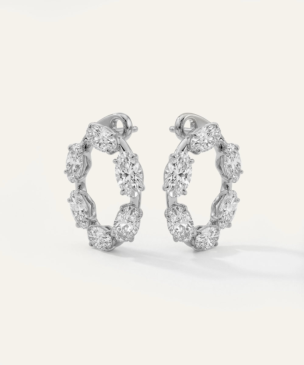 White gold oval-cut diamond scalloped open-hoop earrings.