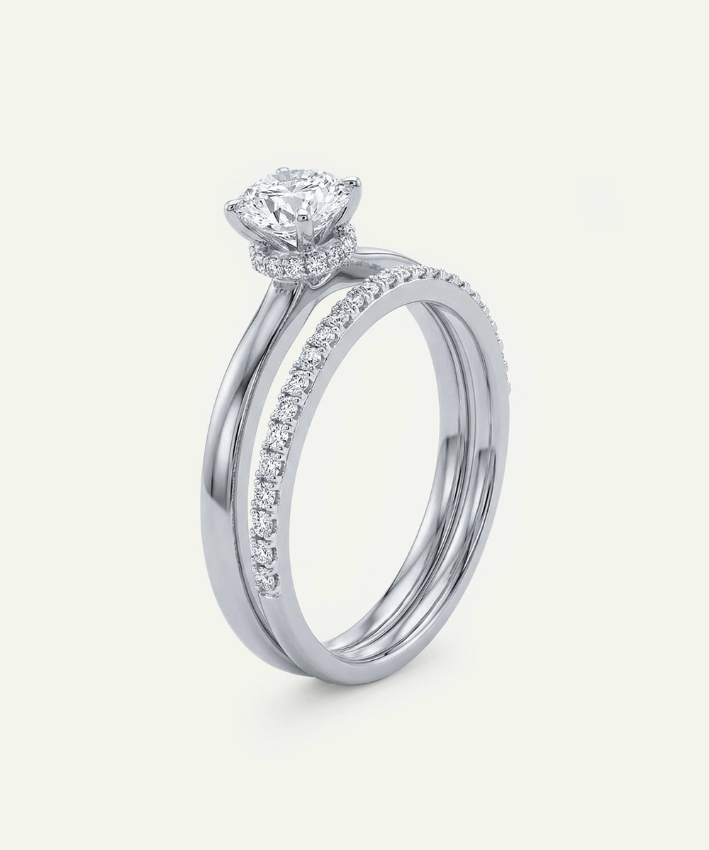 Diamond ring with a heart-shaped center stone on a white background