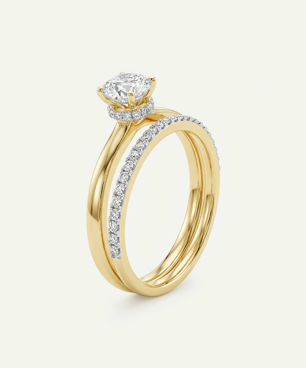Gold ring with a diamond on a white background